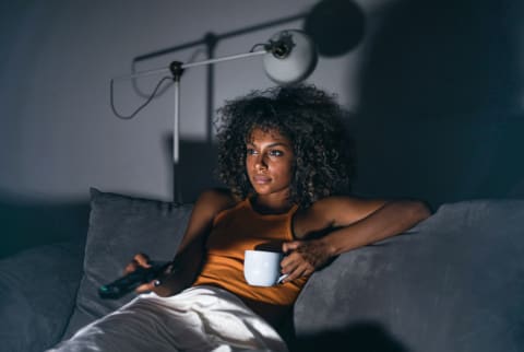 Woman Watching TV at Night